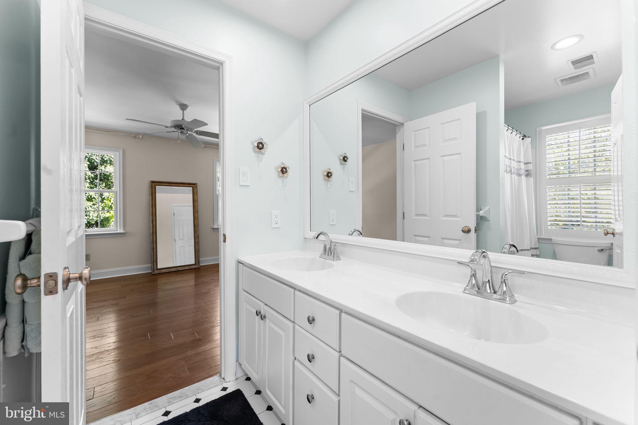 740 Monument Road Malvern, PA 19355 - Photo 34 of 51 a bathroom with double vanity sink and a mirror