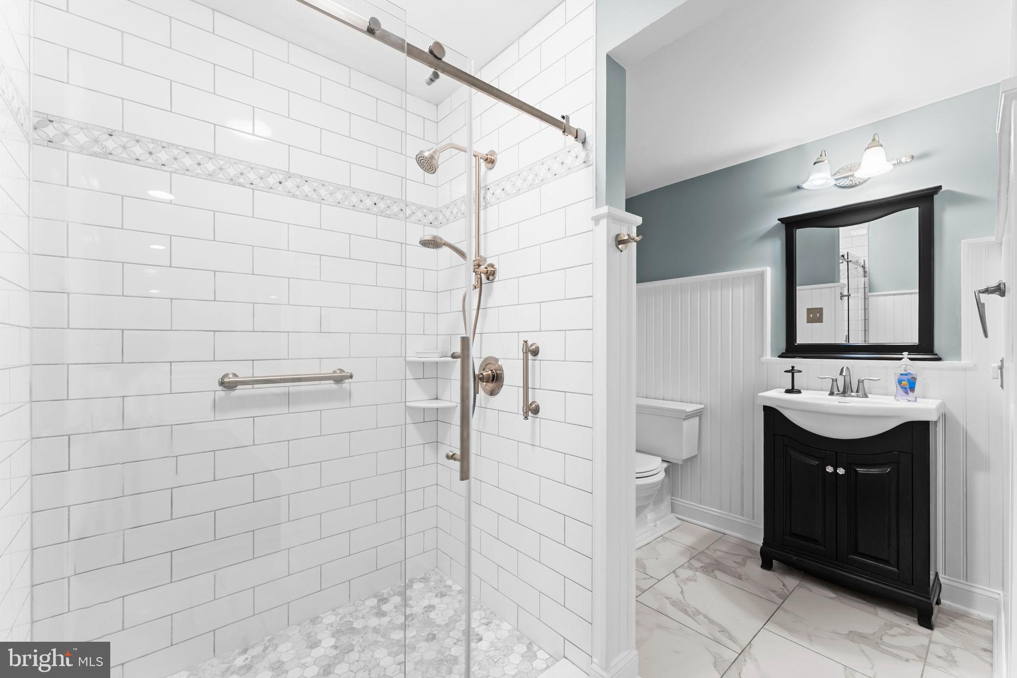 740 Monument Road Malvern, PA 19355 - Photo 40 of 51 a bathroom with a sink a toilet and shower