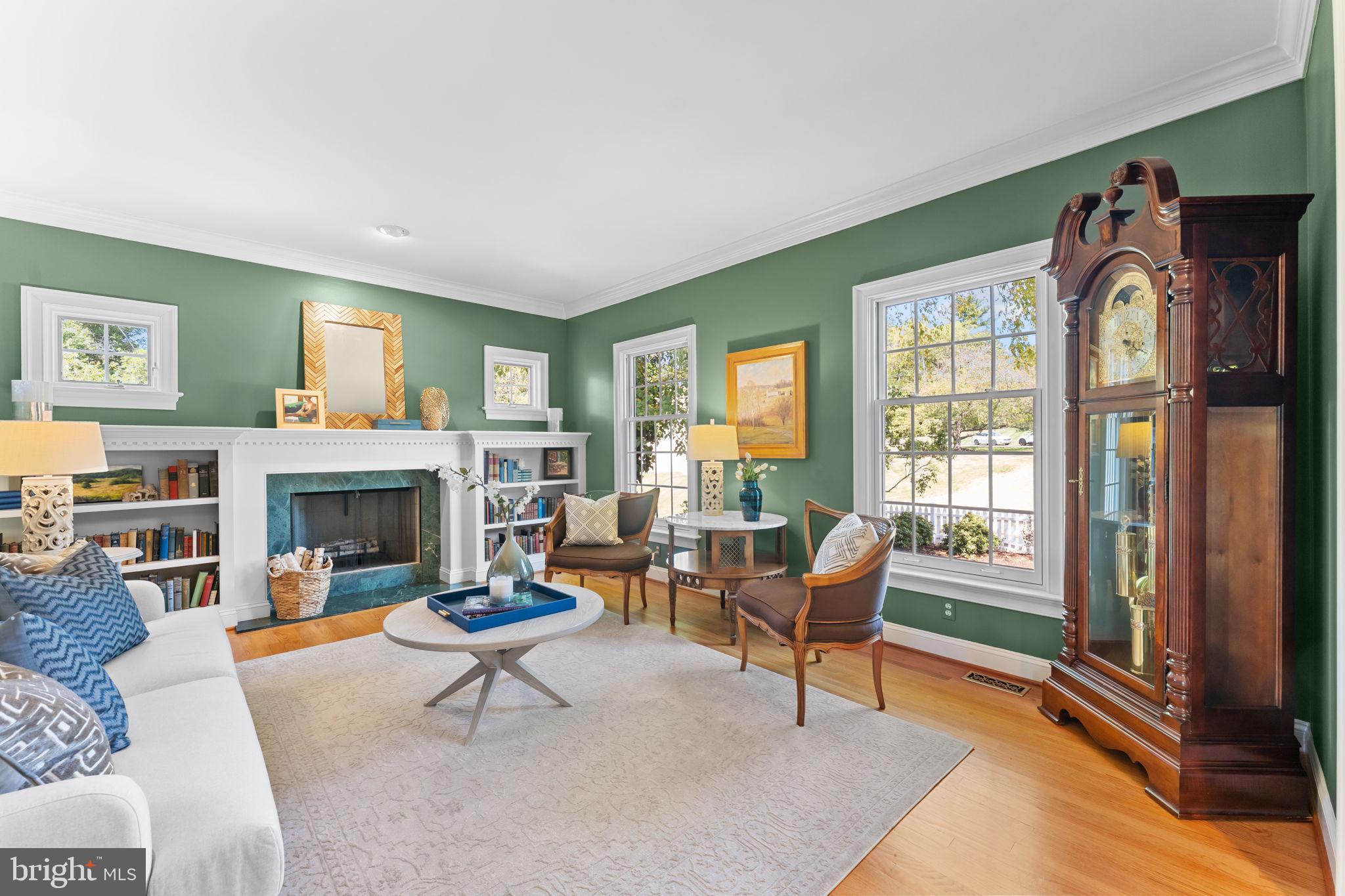 740 Monument Road Malvern, PA 19355 - Photo 6 of 51 a living room with furniture a fireplace and a large window