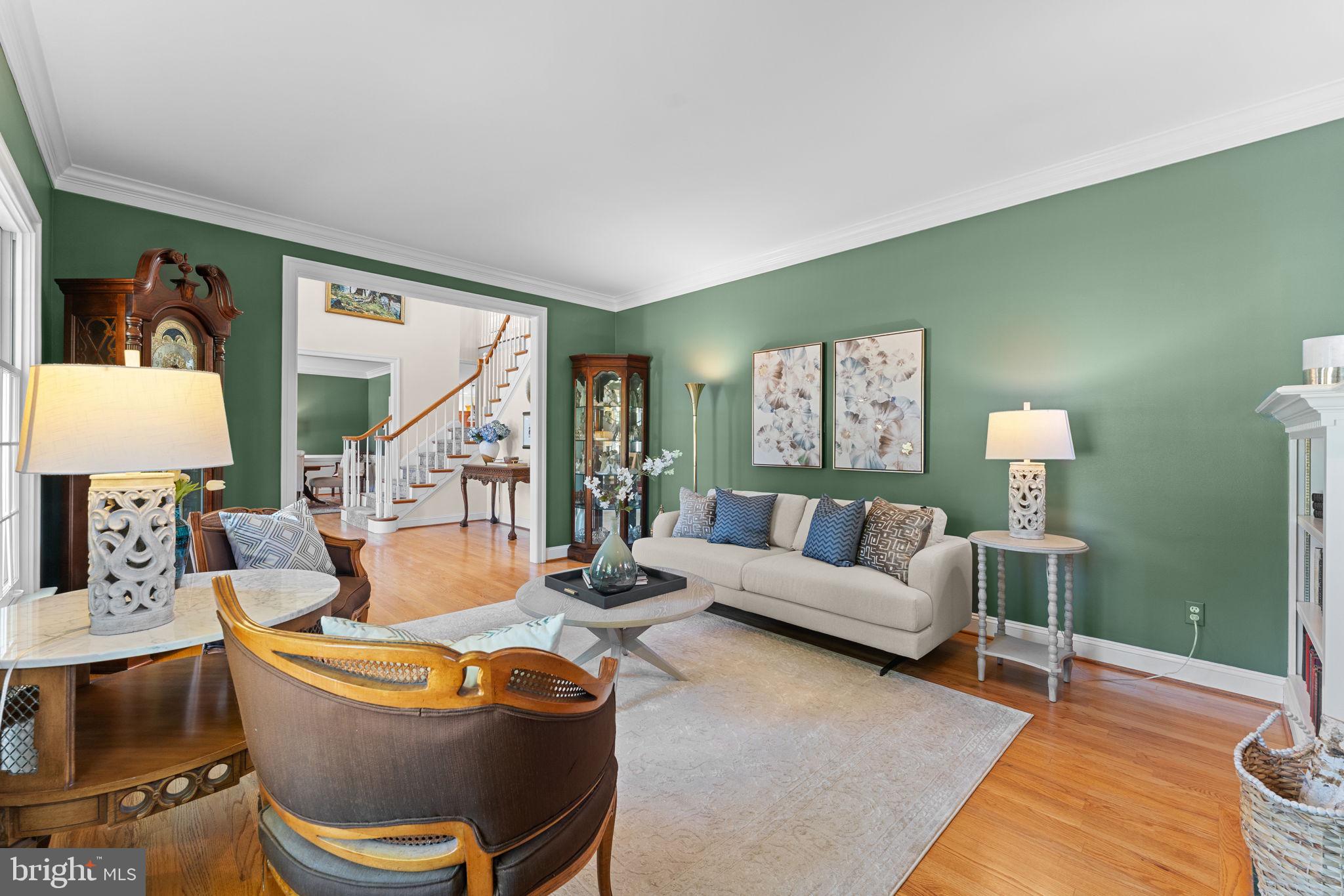 740 Monument Road Malvern, PA 19355 - Photo 7 of 51 a living room with furniture and a lamp