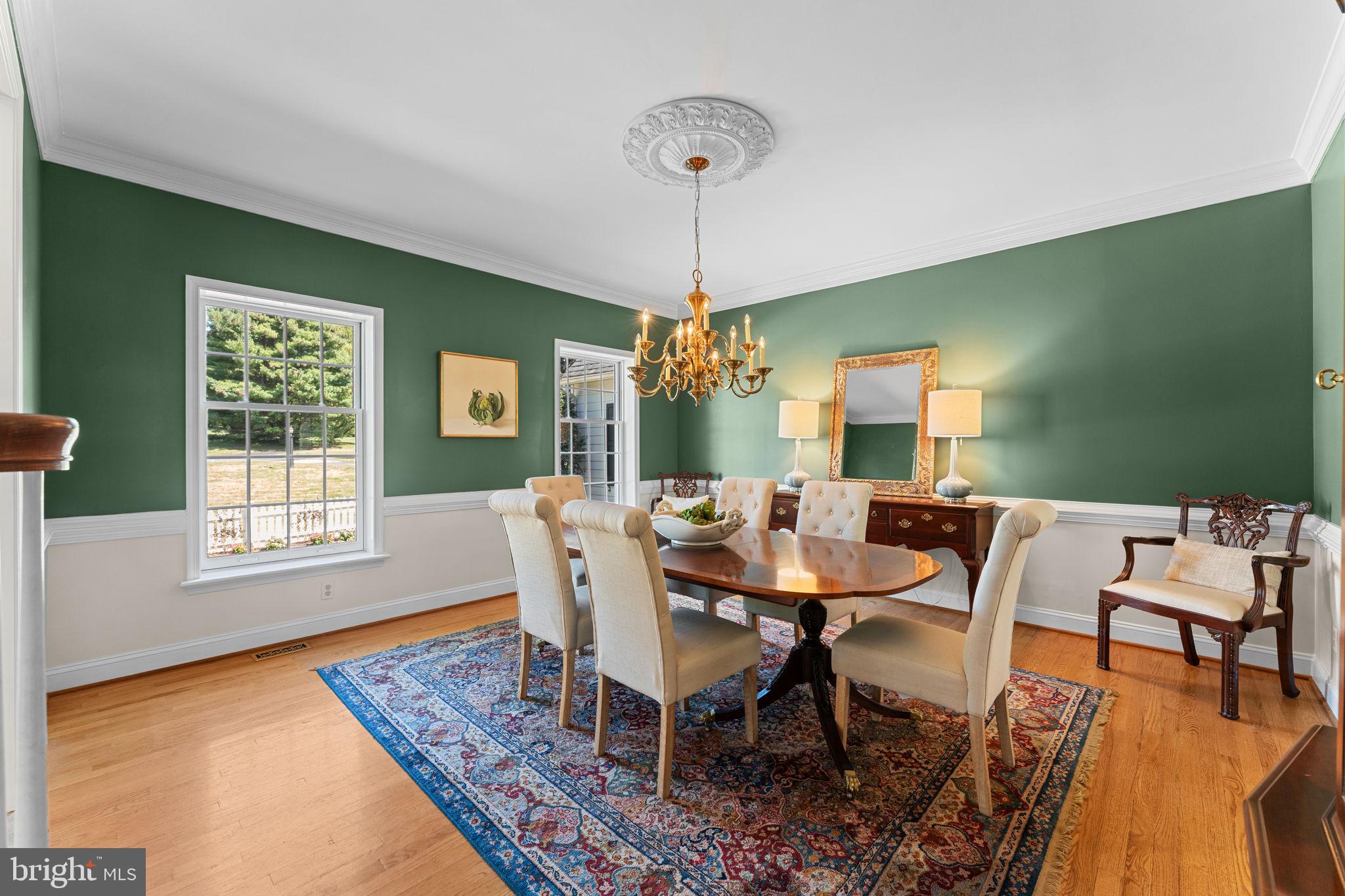 740 Monument Road Malvern, PA 19355 - Photo 8 of 51 a dining room with furniture a rug and wooden floor