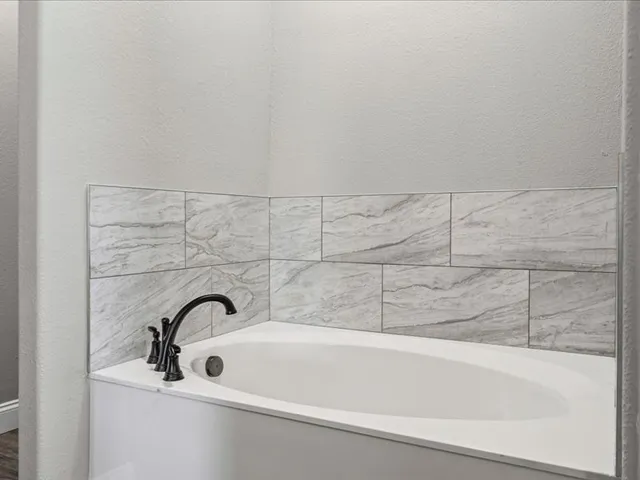 a bathroom with a bathtub