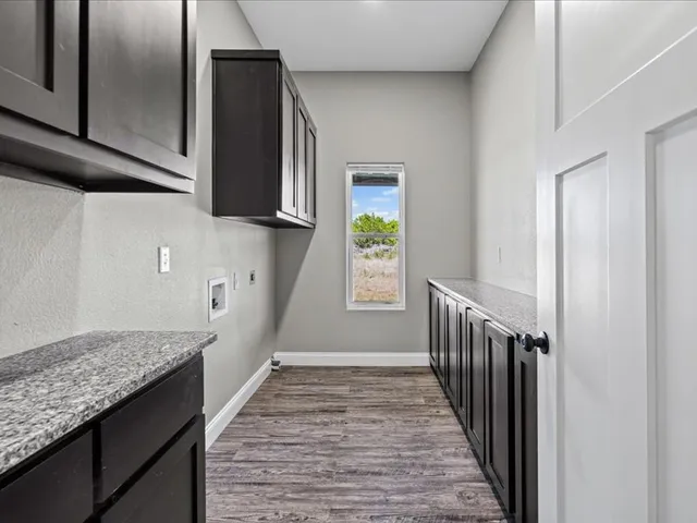 a view of hallway with wooden floor