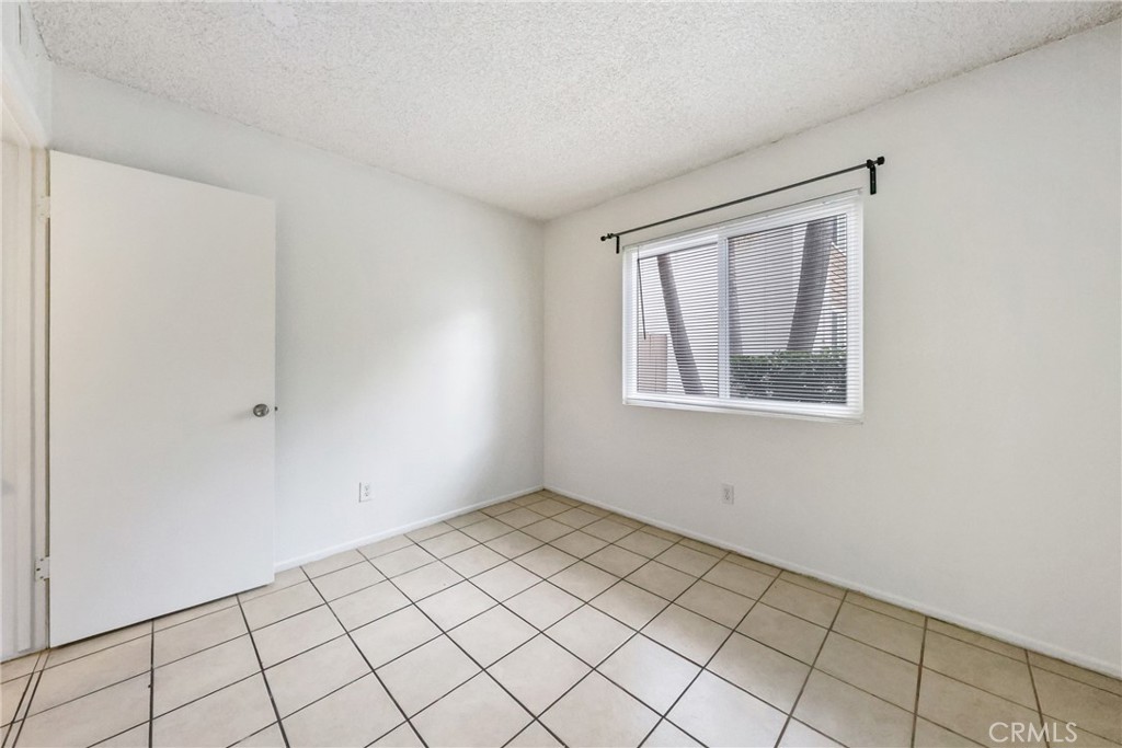 2521 West Sunflower Avenue, Unit R1 Santa Ana, CA 92704 - Photo 16 of 38 a view of an empty room with a window