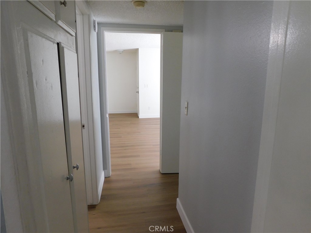 2521 West Sunflower Avenue, Unit R1 Santa Ana, CA 92704 - Photo 22 of 38 Hall from Bedrooms to Living Area
