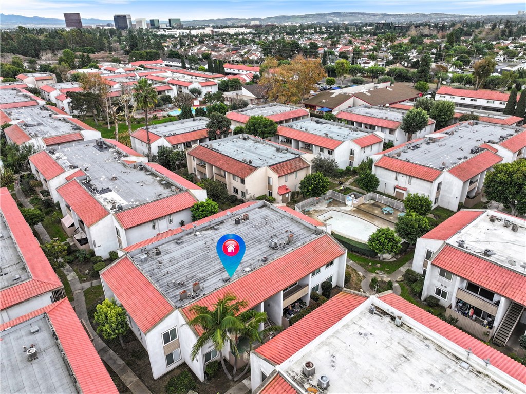 2521 West Sunflower Avenue, Unit R1 Santa Ana, CA 92704 - Photo 26 of 38 an aerial view of a city with lots of residential buildings