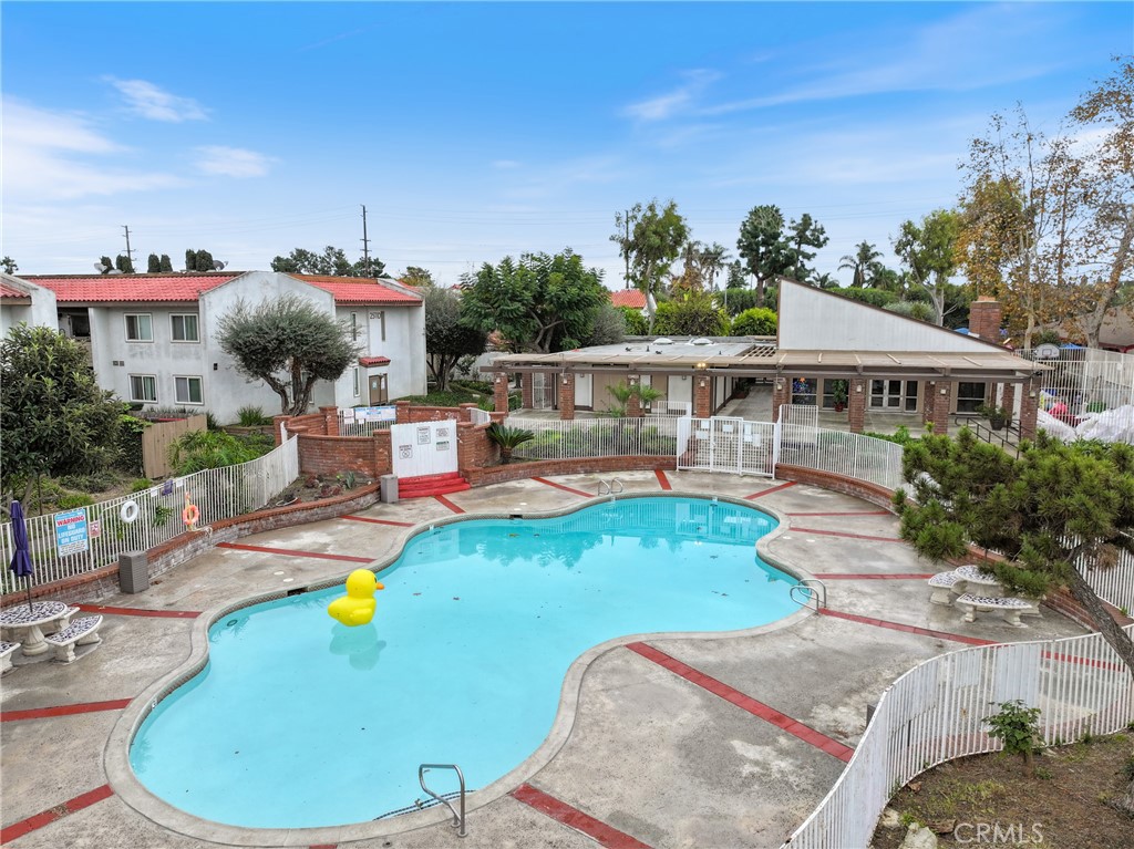 2521 West Sunflower Avenue, Unit R1 Santa Ana, CA 92704 - Photo 29 of 38 a view of a swimming pool with a patio