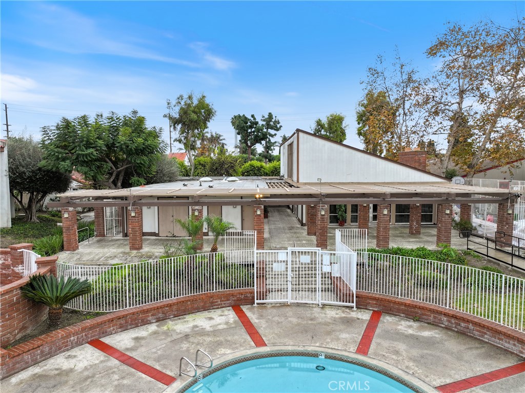2521 West Sunflower Avenue, Unit R1 Santa Ana, CA 92704 - Photo 30 of 38 a view of a house with backyard and sitting area