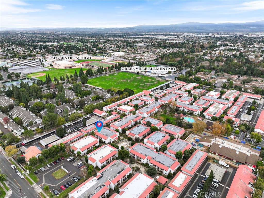 2521 West Sunflower Avenue, Unit R1 Santa Ana, CA 92704 - Photo 34 of 38 an aerial view of a city with lots of residential buildings