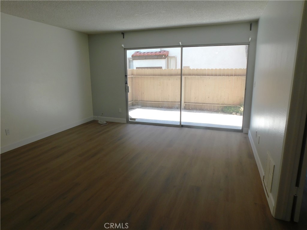 2521 West Sunflower Avenue, Unit R1 Santa Ana, CA 92704 - Photo 4 of 38 Spacious Living Room & Patio