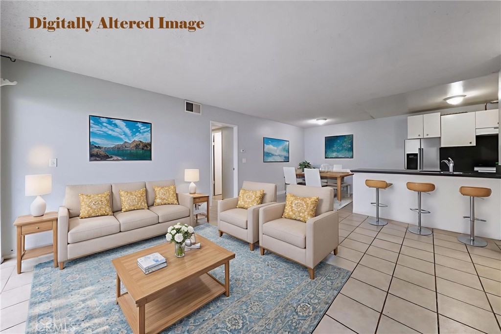 2521 West Sunflower Avenue, Unit R1 Santa Ana, CA 92704 - Photo 5 of 38 a living room with furniture and kitchen view