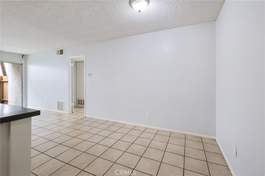 2521 West Sunflower Avenue, Unit R1 Santa Ana, CA 92704 - Photo 9 of 38 a view of an empty room