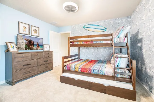 a patio with a table and chairs under an umbrella