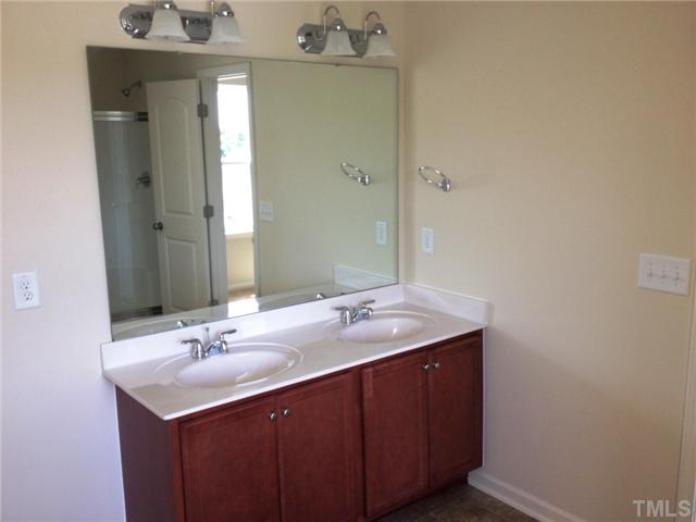 6620 Horseback Lane Raleigh, NC 27610 - Photo 7 of 12 Owners suite with cultured marble double vanity. Notice reflection, separate tub and shower