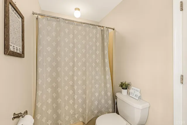 a bed room with a bed and a television