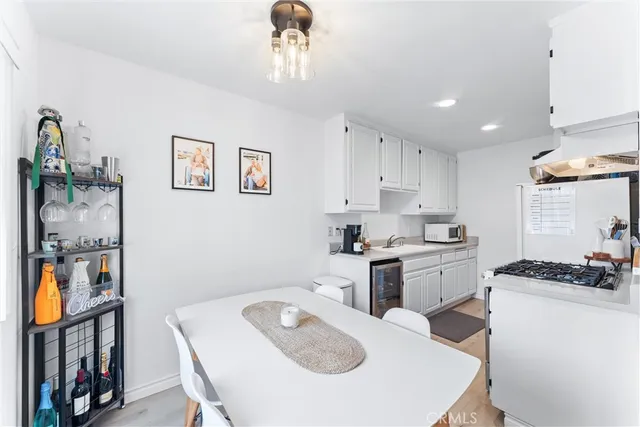 a kitchen that has a cabinets and a stove in it