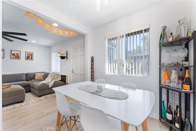 a living room with furniture a window and a table
