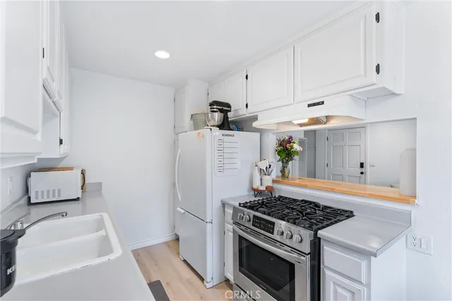 a kitchen with a stove and a refrigerator