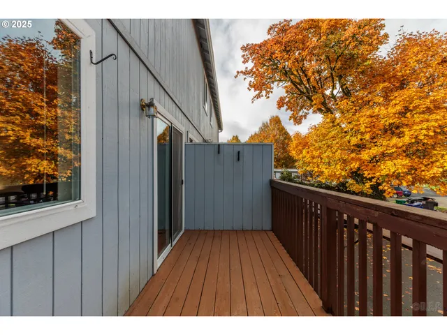 a balcony view with wooden floor