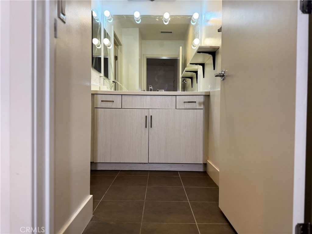 2205 Tom Mix Road Los Angeles, CA 90026 - Photo 13 of 20 a bathroom with a sink and a mirror