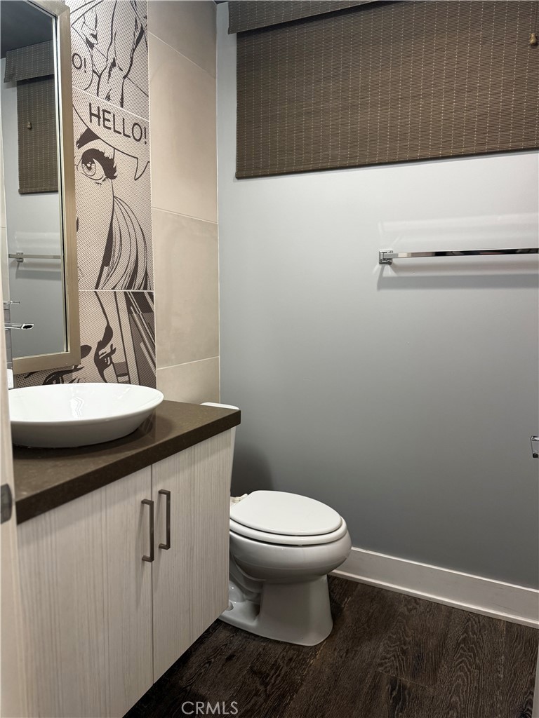 2205 Tom Mix Road Los Angeles, CA 90026 - Photo 16 of 20 a bathroom with a sink toilet and vanity