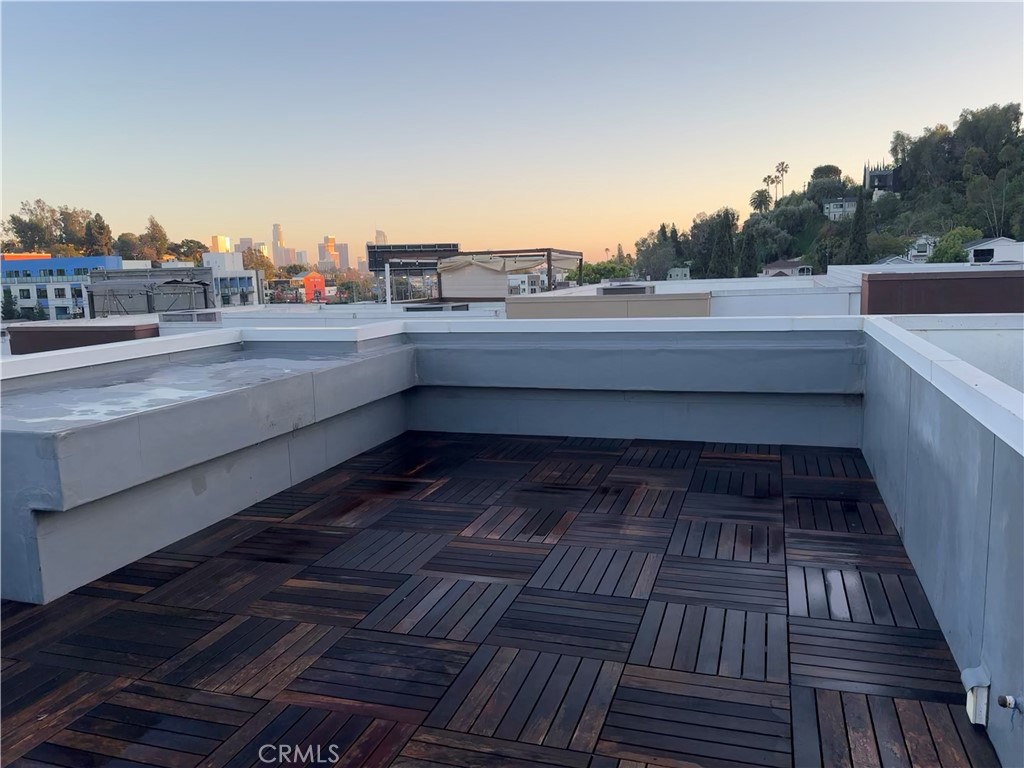 2205 Tom Mix Road Los Angeles, CA 90026 - Photo 17 of 20 a view of a balcony with wooden floor and city view