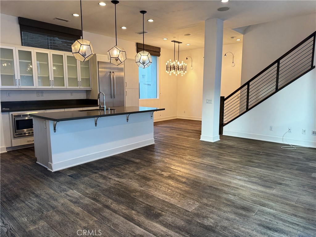 2205 Tom Mix Road Los Angeles, CA 90026 - Photo 2 of 20 a kitchen with stainless steel appliances granite countertop a stove a sink and a refrigerator