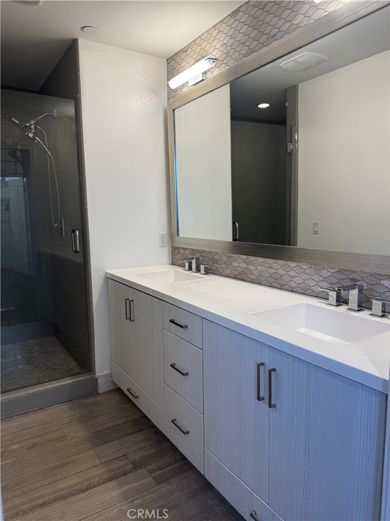 2205 Tom Mix Road Los Angeles, CA 90026 - Photo 9 of 20 a bathroom with a sink and a mirror