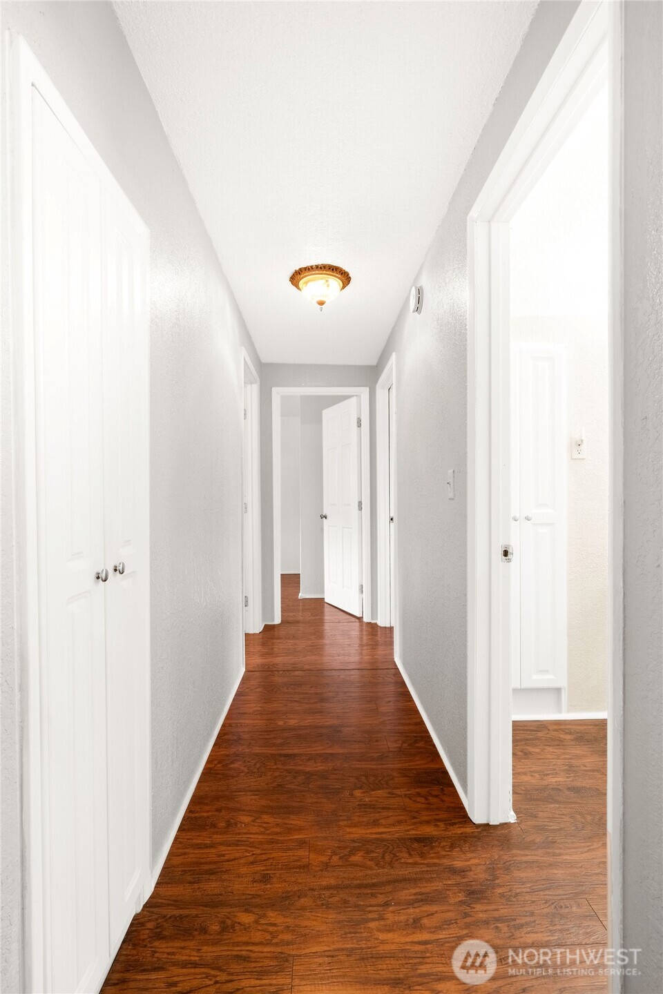 504 South 6th Street McCleary, WA 98557 - Photo 12 of 40 a view of a hallway with wooden floor
