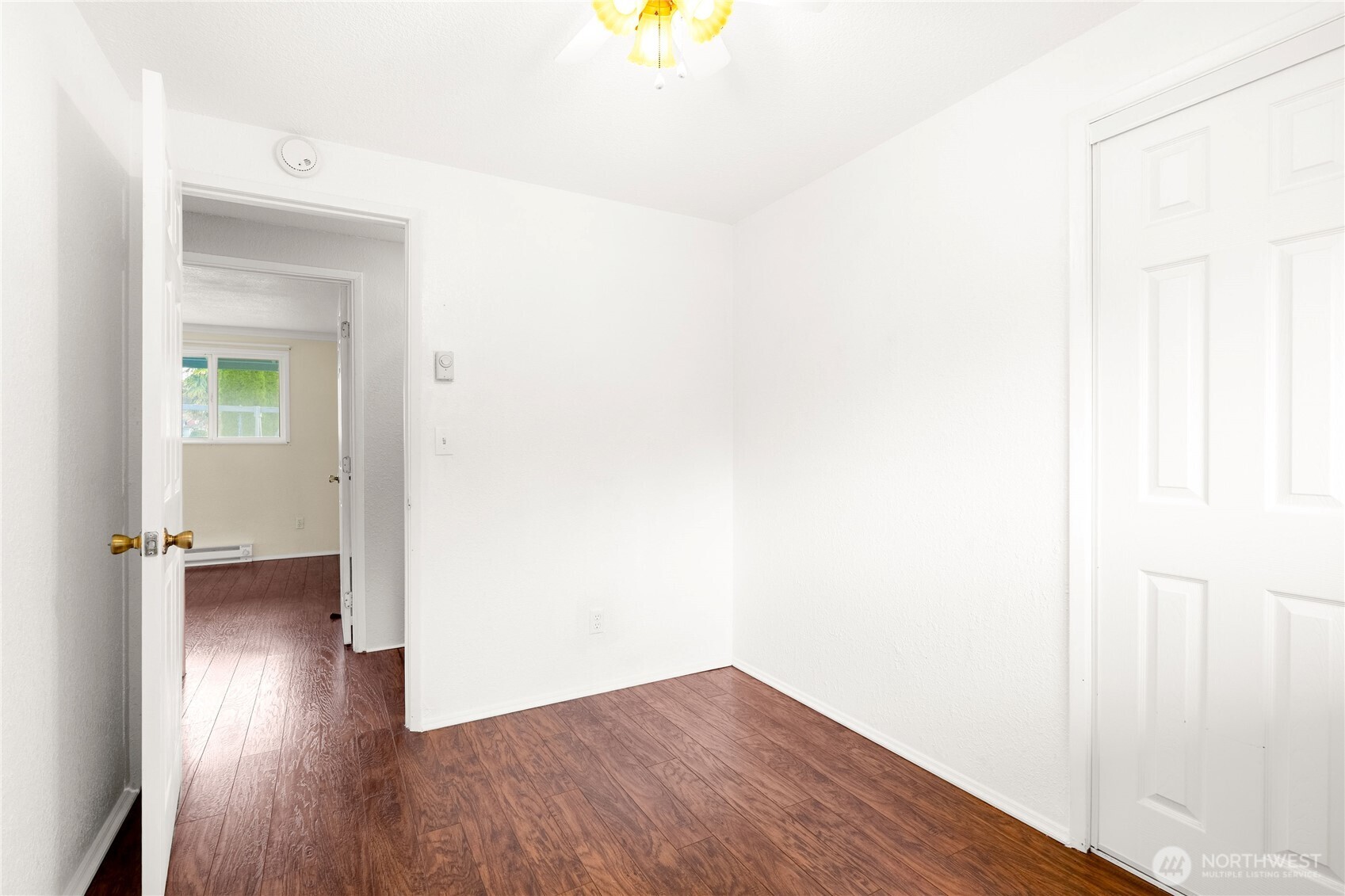 504 South 6th Street McCleary, WA 98557 - Photo 15 of 40 a view of a hallway with wooden floor