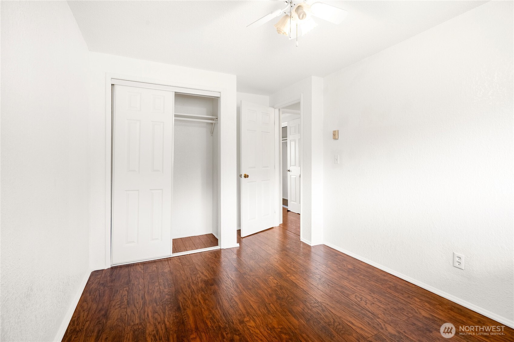 504 South 6th Street McCleary, WA 98557 - Photo 19 of 40 a view of an empty room with wooden floor