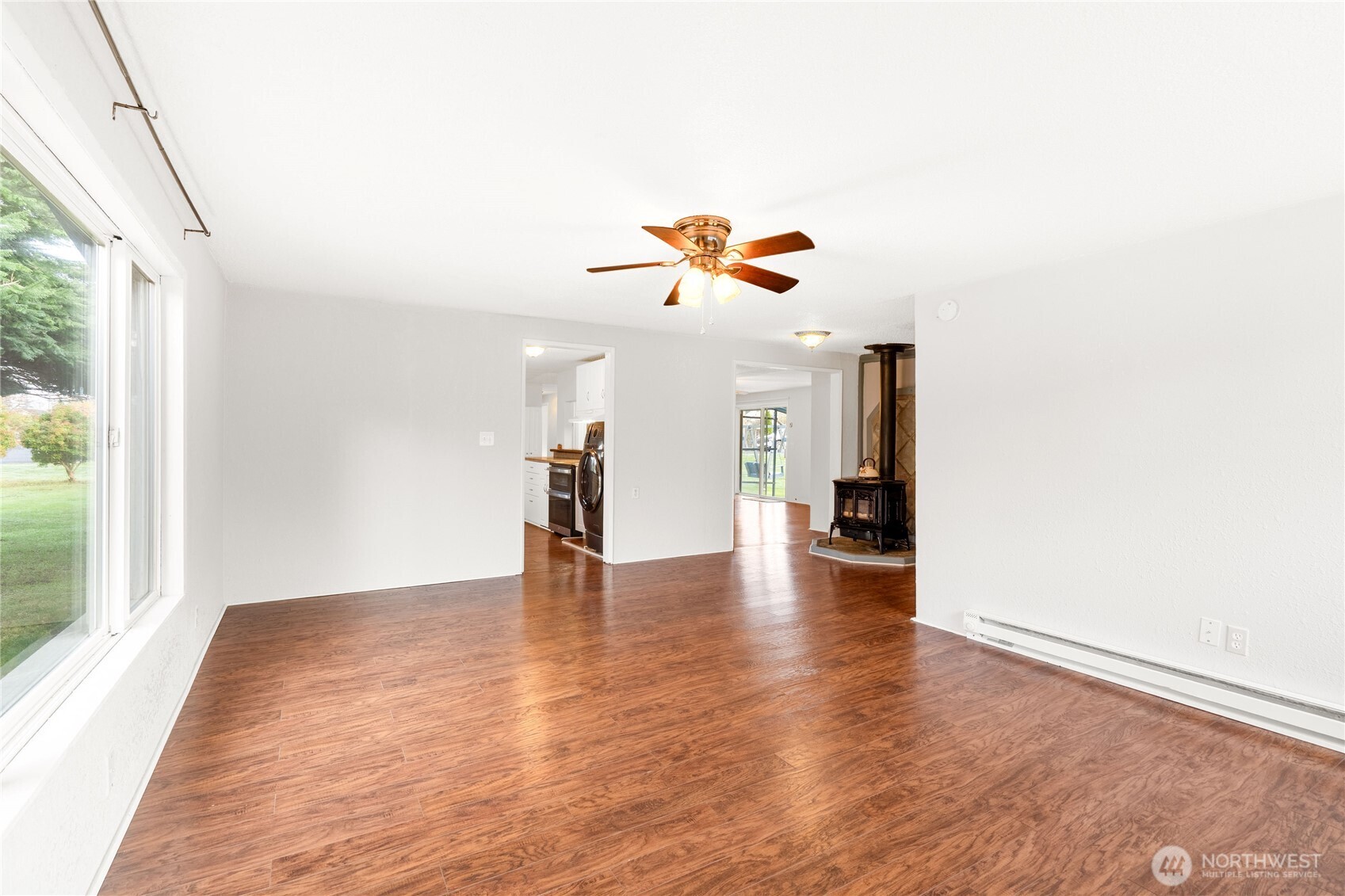 504 South 6th Street McCleary, WA 98557 - Photo 22 of 40 a view of an empty room with wooden floor and a window