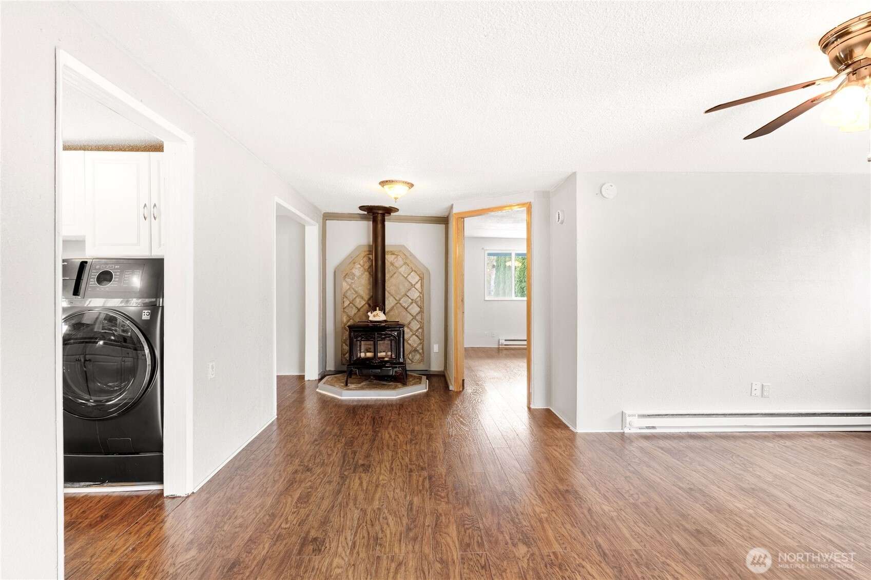 504 South 6th Street McCleary, WA 98557 - Photo 23 of 40 a view of a hallway with a washer and dryer