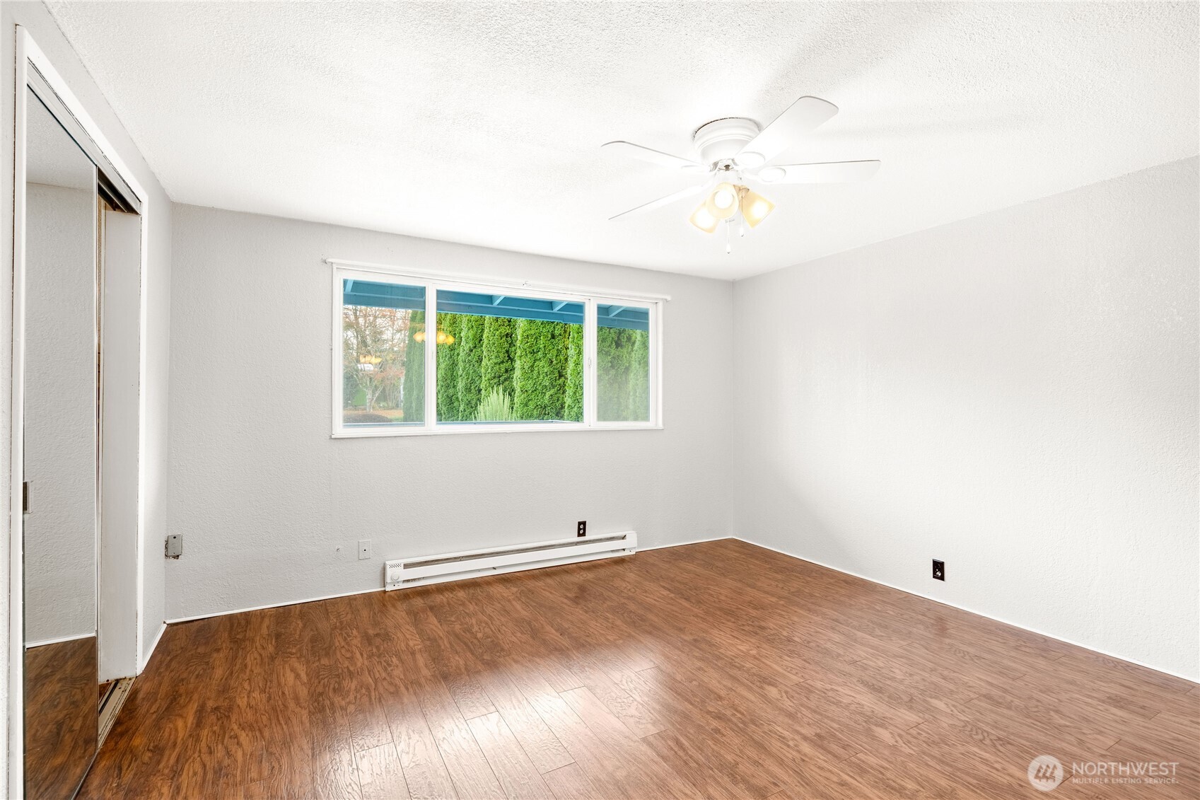 504 South 6th Street McCleary, WA 98557 - Photo 24 of 40 wooden floor in an empty room with a window