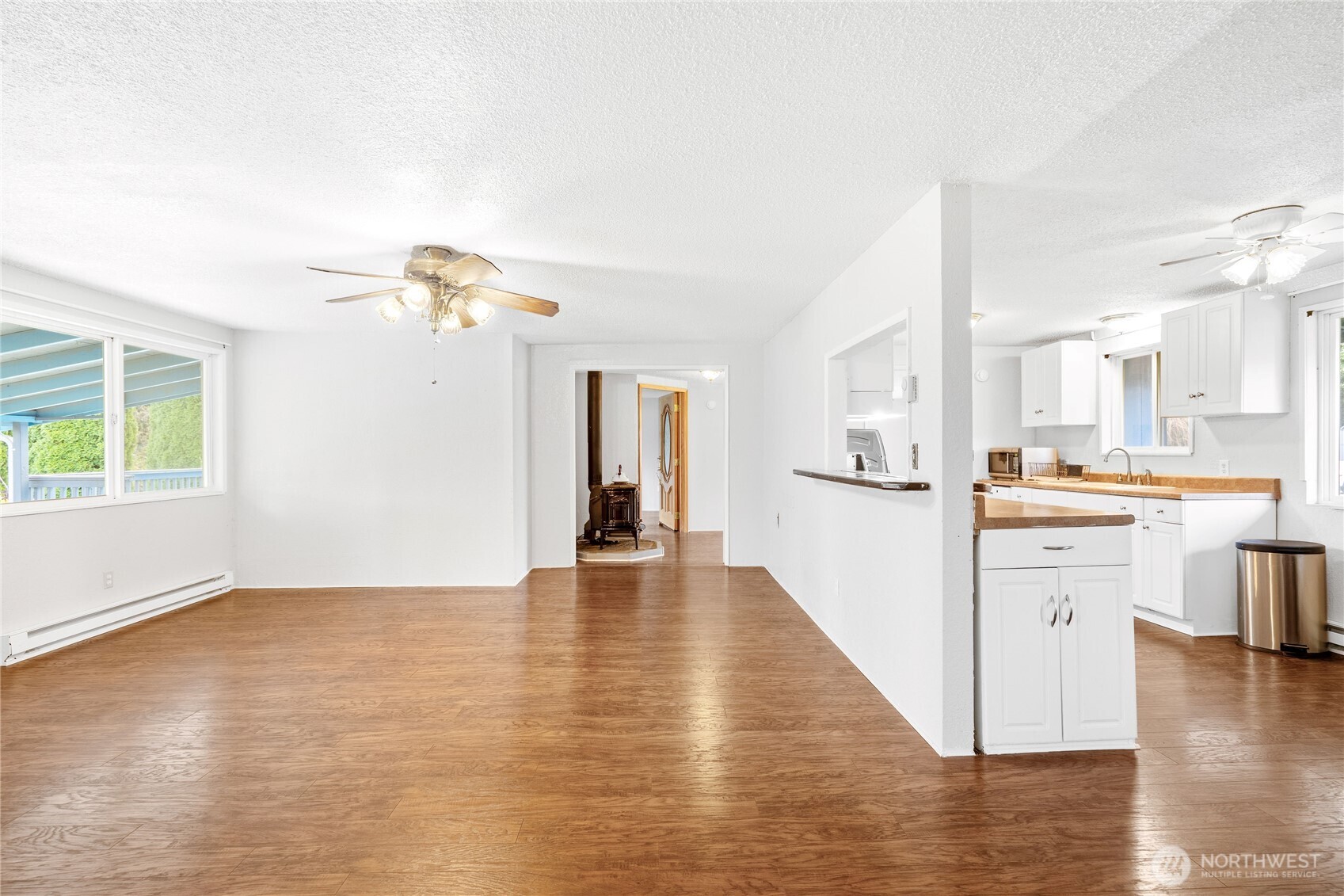504 South 6th Street McCleary, WA 98557 - Photo 9 of 40 a view of a kitchen with wooden floor