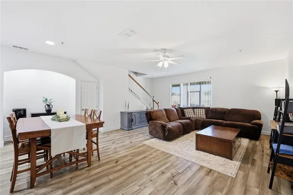 a living room with furniture dining table and a couch