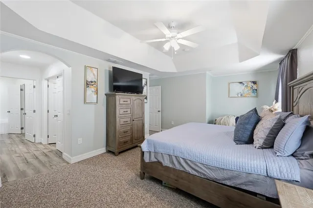 a bathroom with a granite countertop sink a large mirror and shower