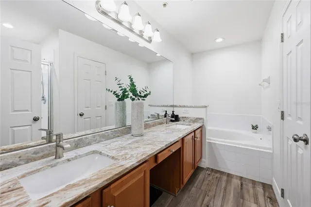 a bathroom with a bathtub and shower