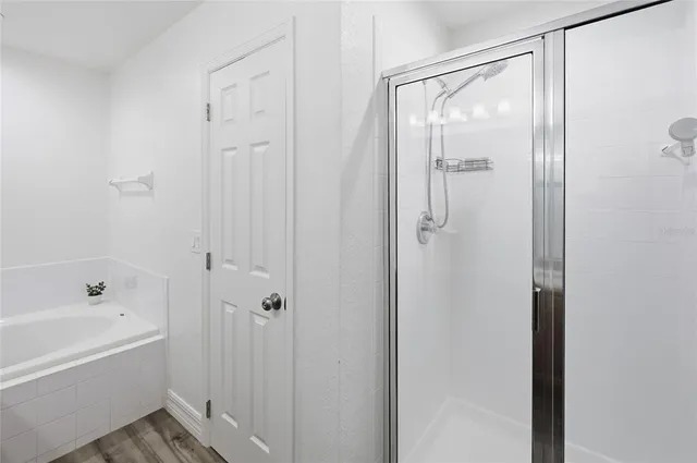 a view of a bathroom with a shower curtain and a sink
