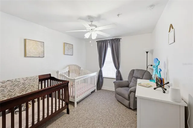 a bedroom with furniture and a window