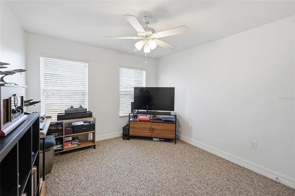 a room with furniture and a flat screen tv