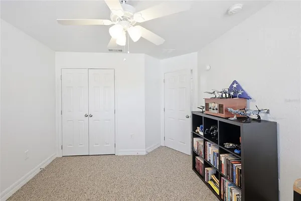 a utility room with dryer washer and a fridge
