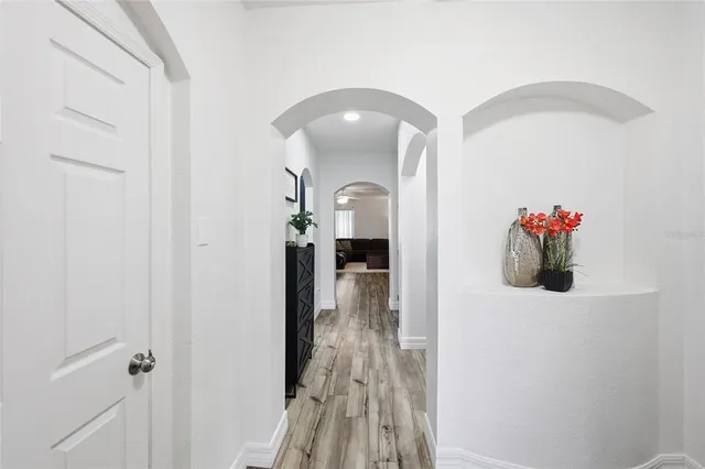 a kitchen with a refrigerator a stove top oven a sink and cabinets