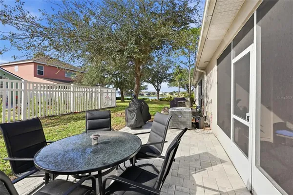 a view of a house with backyard sitting area and garden