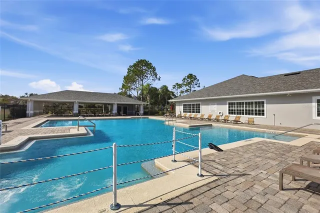a view of a livingroom with furniture and a kitchen