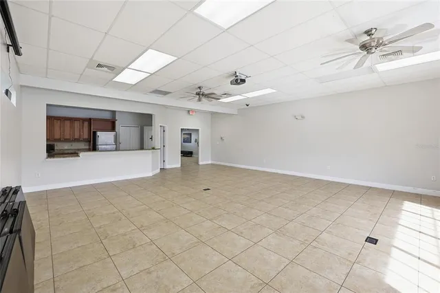 an aerial view of residential houses with outdoor space and lake view