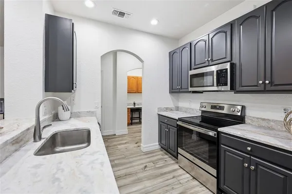 a view of cabinets with wooden floor and cabinet