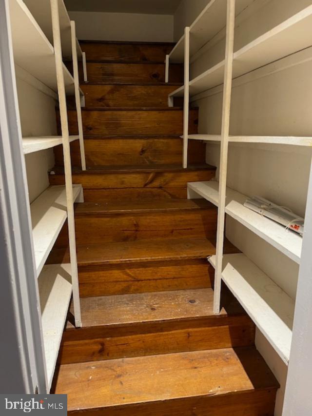 7032 Token Valley Road Manassas, VA 20112 - Photo 11 of 25 a view of walk in closet with empty racks