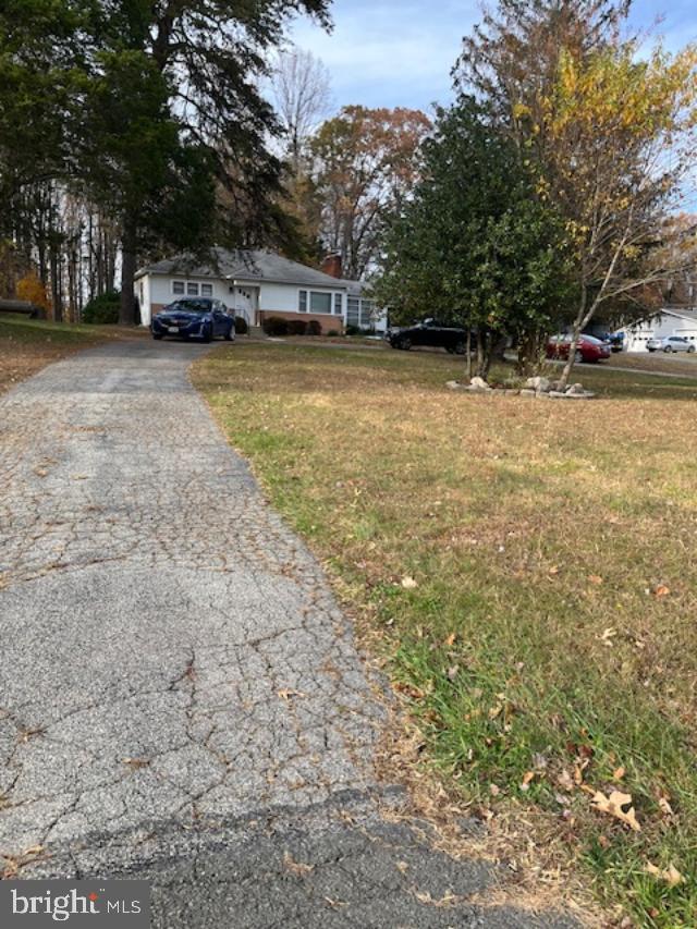 7032 Token Valley Road Manassas, VA 20112 - Photo 2 of 25 a view of a yard with a trees