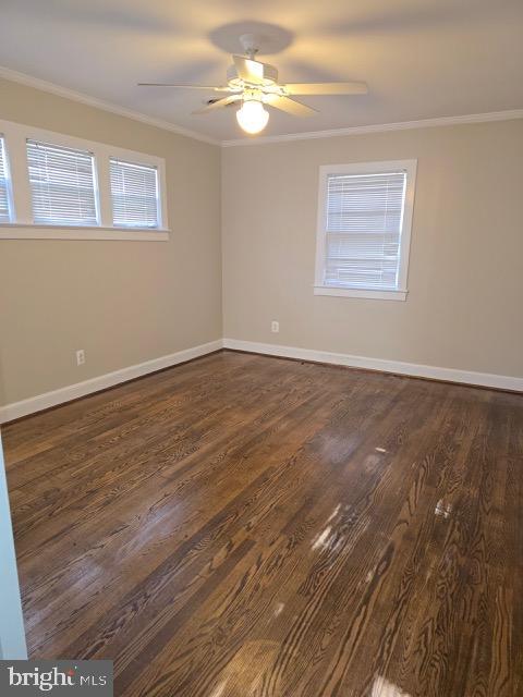 7032 Token Valley Road Manassas, VA 20112 - Photo 8 of 25 a view of an empty room with chandelier fan and wooden floor